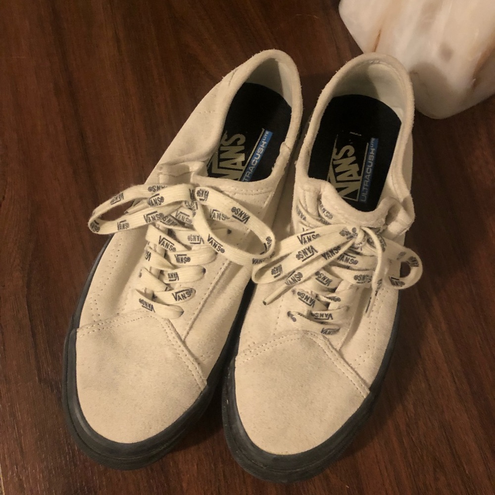 Cream and black vans